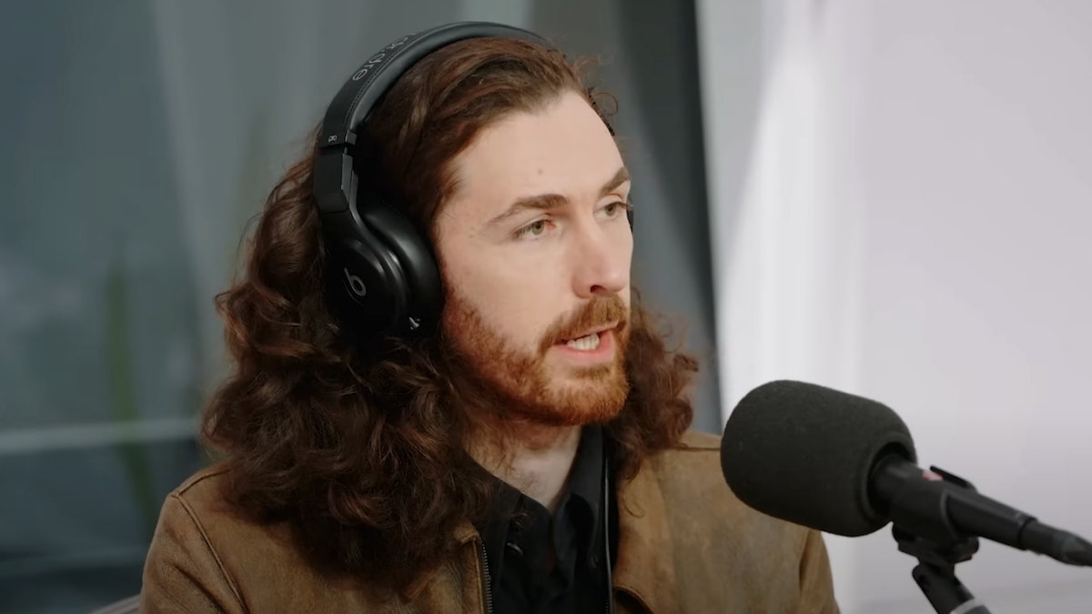 Hozier talks into microphone